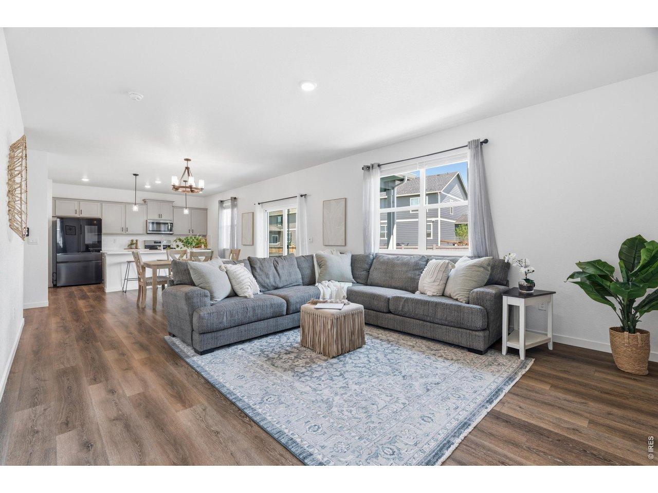 Image 2: Spacious open floor plan offers comfortable gathering spaces and effortless flow to the kitchen and dining areas. Image 2: Spacious open floor plan offers comfortable gathering spaces and effortless flow to the kitchen and dining areas.