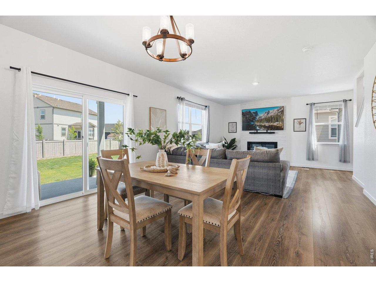 Image 3: Open-concept main living area seamlessly connects the dining space, great room, and backyard access. Image 3: Open-concept main living area seamlessly connects the dining space, great room, and backyard access.