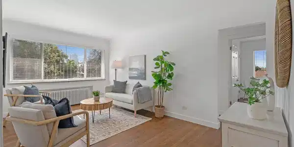 Image 4: Natural light in living room, refinished hardwood floors