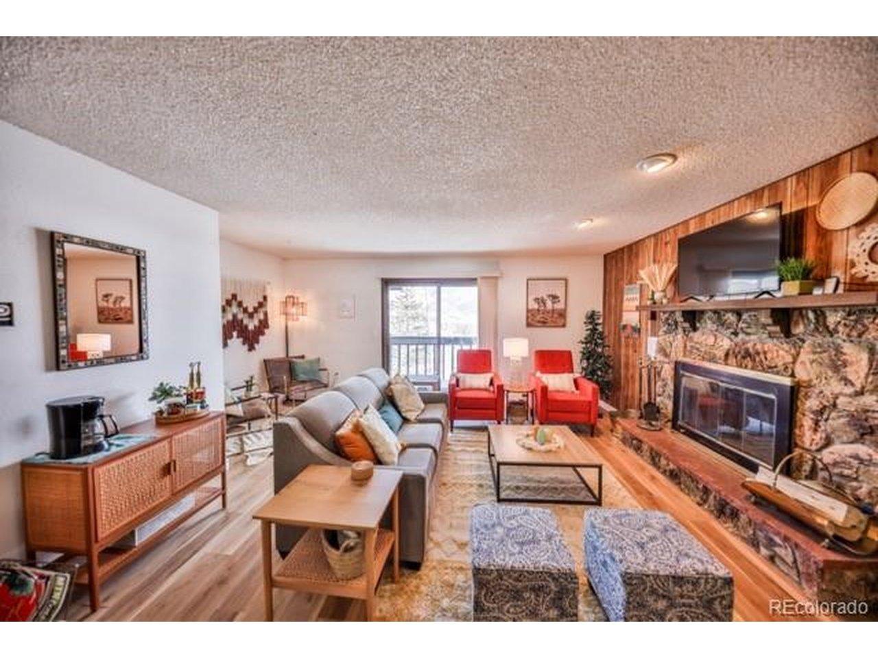 Image 3: Inviting Living area with wood buring fireplace Image 3: Inviting Living area with wood buring fireplace
