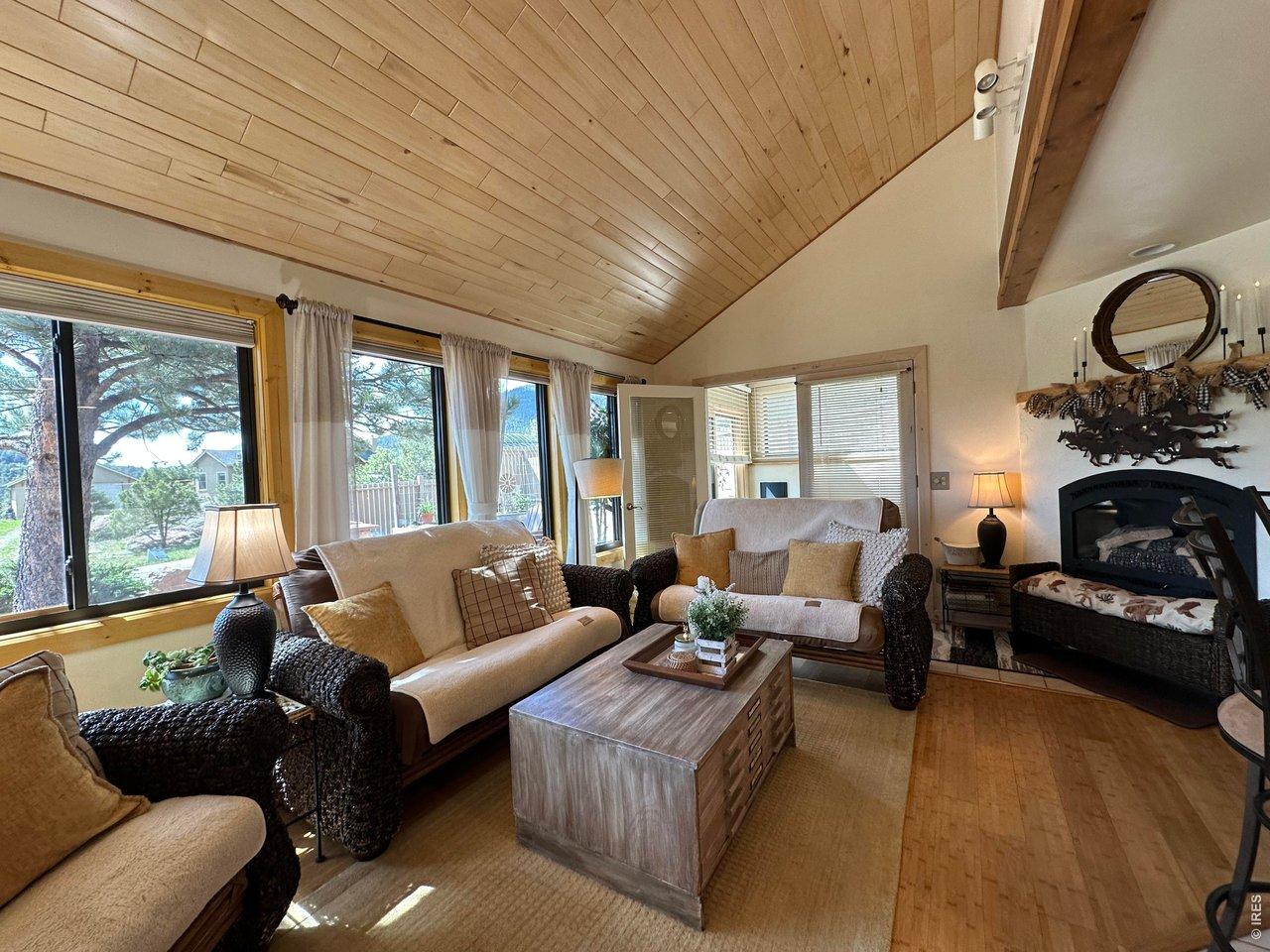 Image 3: Living Room with Gas Fireplace and entrance to sun room Image 3: Living Room with Gas Fireplace and entrance to sun room
