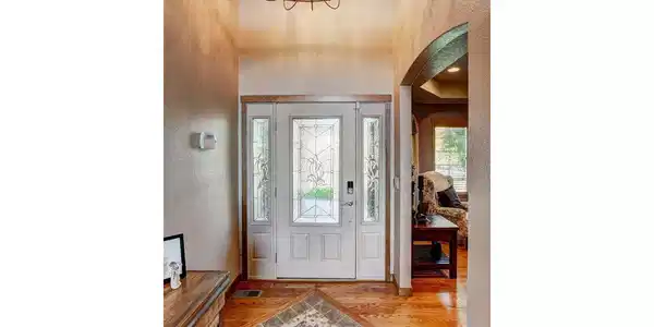 Image 4: Stunning 2 story foyer with tile inset and updated lighting