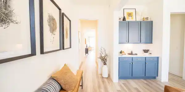 Image 2: Upon entering, you are greeted by a gorgeous front room, personalize for a sitting room, dining room, or front office, tall ceilings and tall windows alow natural light in.