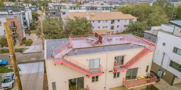 Image 3: Back of unit with city views from roof top deck, balcony deck, and garage Image 3: Back of unit with city views from roof top deck, balcony deck, and garage