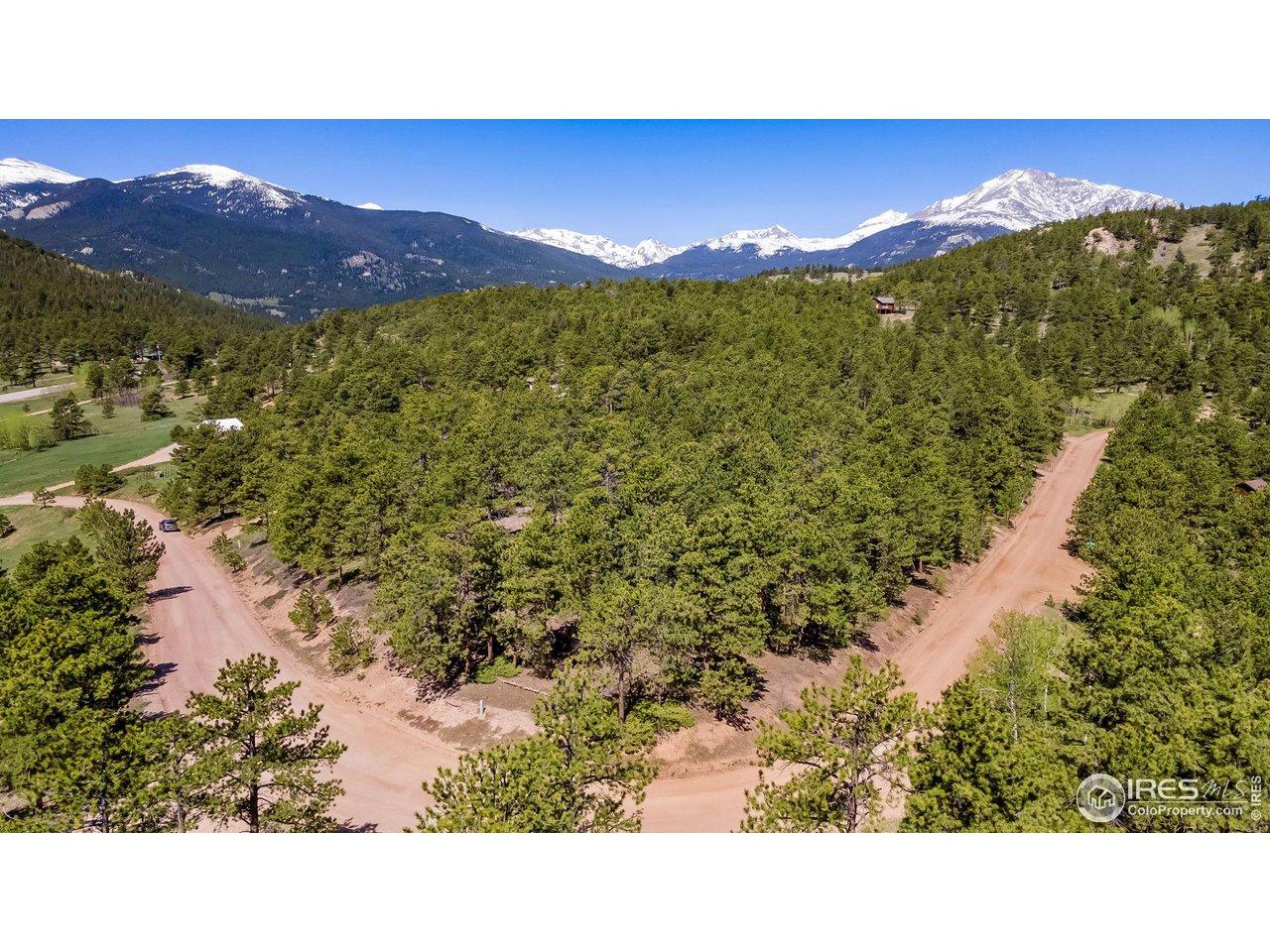 Image 2: The road wraps around the property. Image 2: The road wraps around the property.