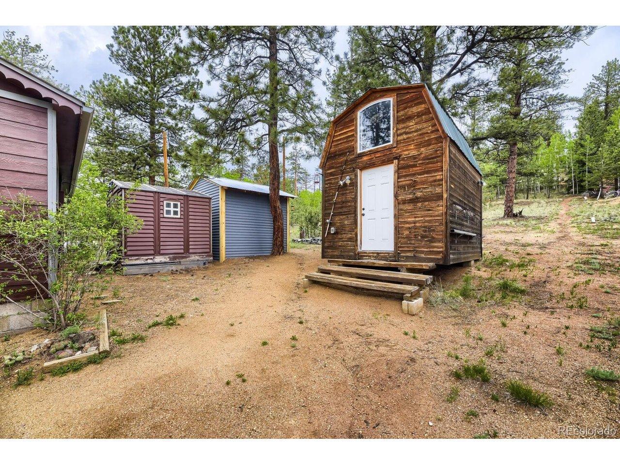 Image 2: Finished outbuilding guest space with electric and 2 nice sheds