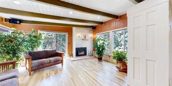 Image 3: Living Room with wood burning fireplace with a blower