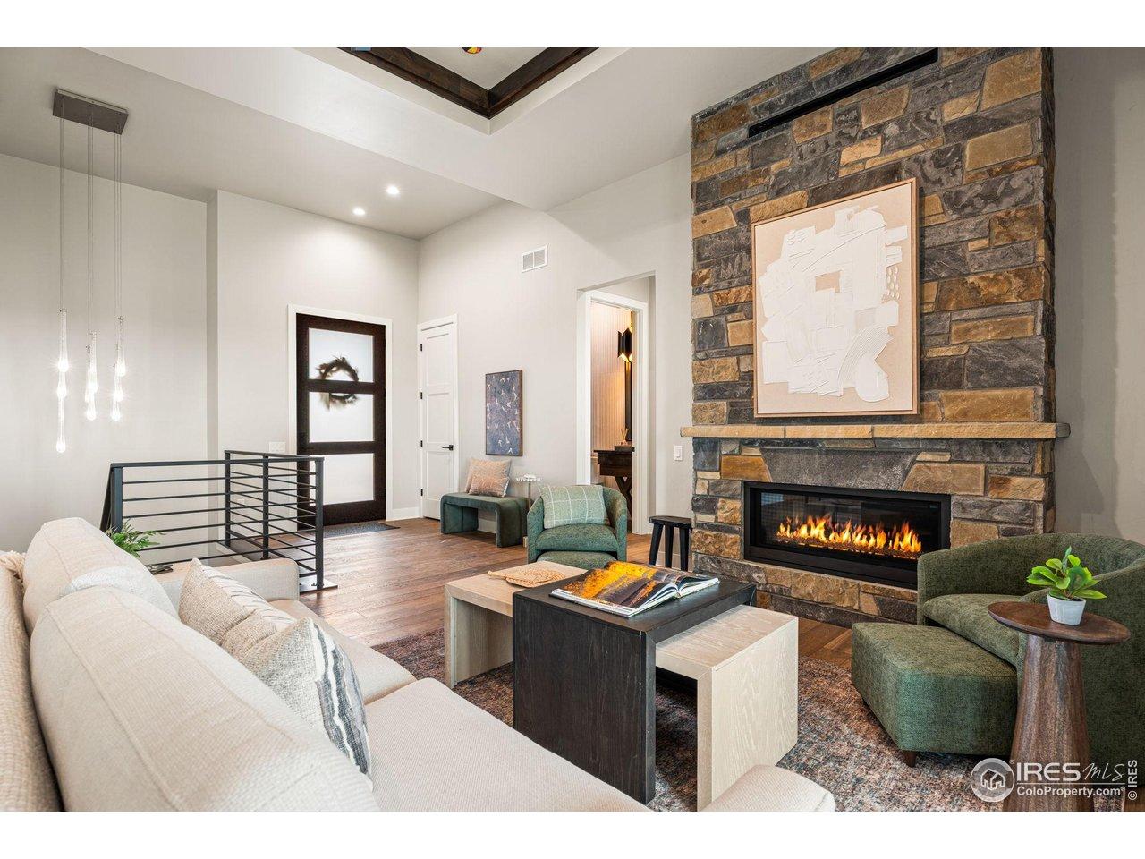 Image 2: A stone fireplace warms the living room Image 2: A stone fireplace warms the living room