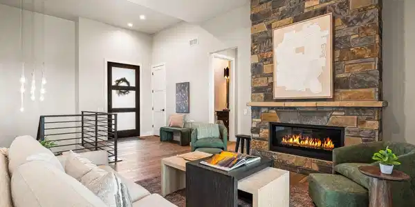Image 2: A stone fireplace warms the living room Image 2: A stone fireplace warms the living room