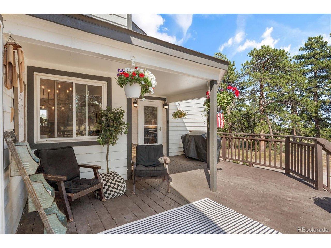 Image 2: The wraparound front porch, built for morning coffee, wildlife watching, and slow Colorado mornings. Image 2: The wraparound front porch, built for morning coffee, wildlife watching, and slow Colorado mornings.