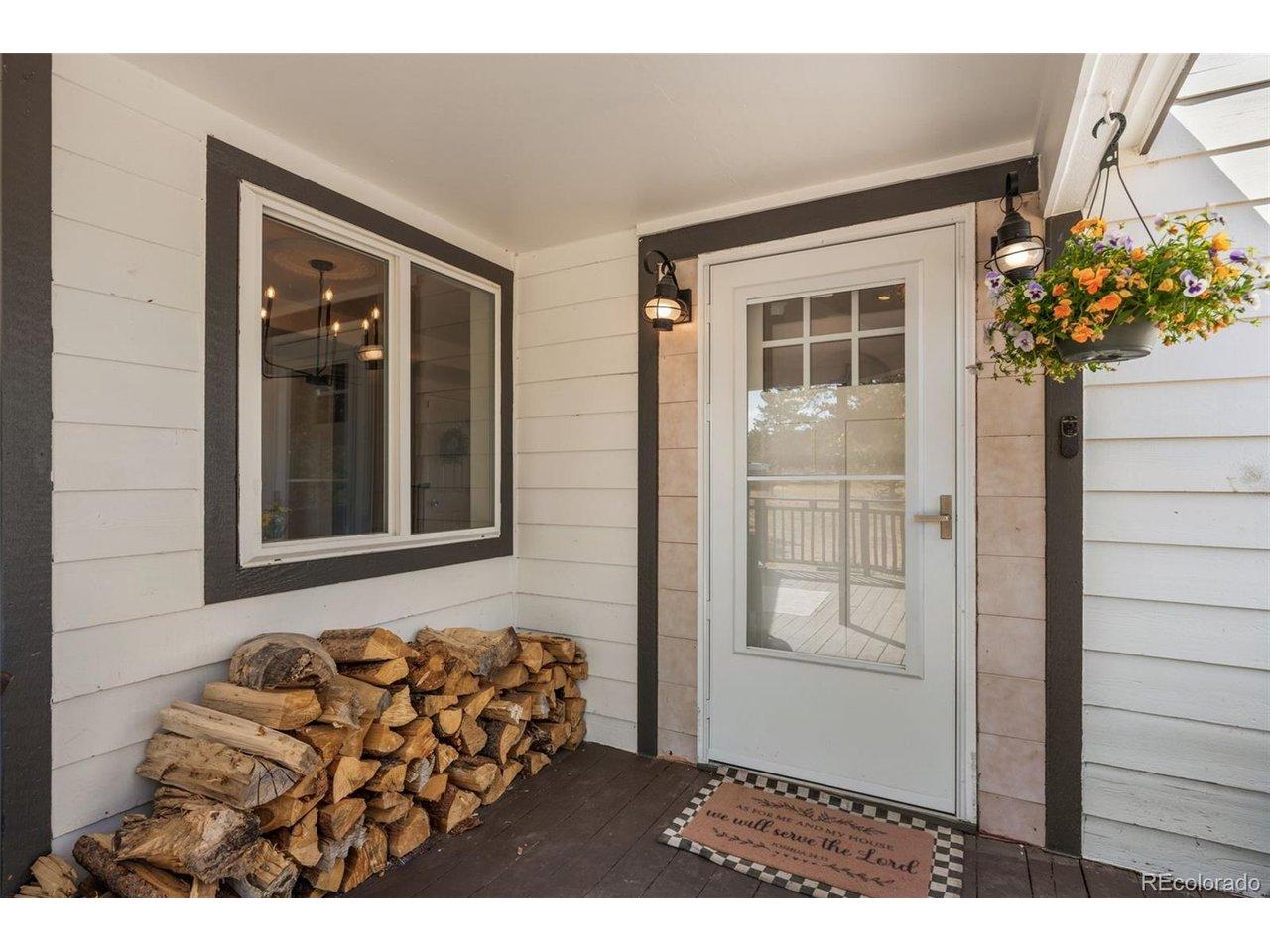Image 3: Hanging flowers, mountain air, and a front porch that sees more elk traffic than car traffic. Image 3: Hanging flowers, mountain air, and a front porch that sees more elk traffic than car traffic.