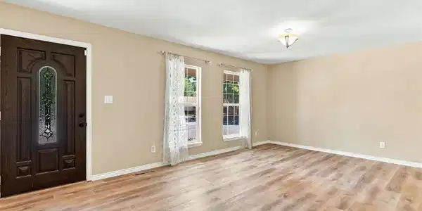 Image 3: The spacious living room is open and bright. Image 3: The spacious living room is open and bright.