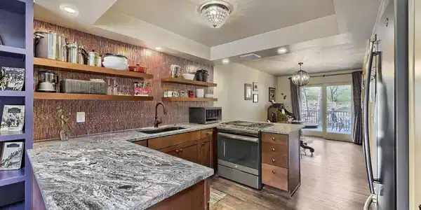 Image 2: Granite counters, pantry, glass blacksplash, gas range. Image 2: Granite counters, pantry, glass blacksplash, gas range.