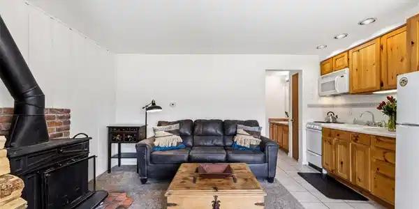 Image 2: This great condo is laid out with views from the living area and a sunny spot with a view for dining.
