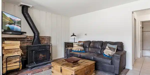 Image 4: Cozy wood-burning stove for a snowy winter night by the fire.