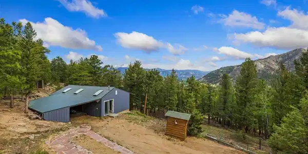 Image 3: Heated outbuilding with skylights and carport