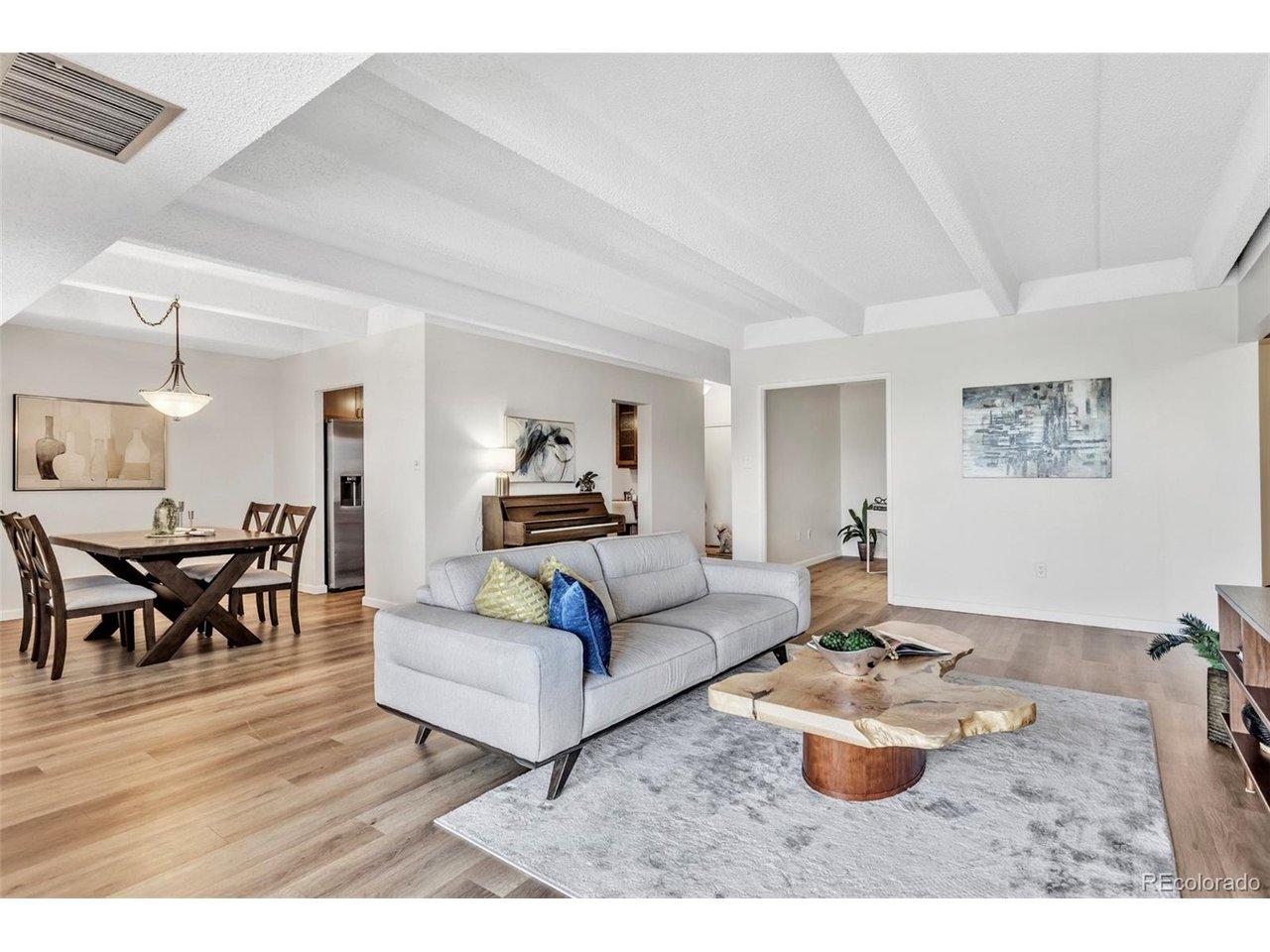 Image 3: Multiple seating areas create a warm, inviting space that lives larger than expected. Image 3: Multiple seating areas create a warm, inviting space that lives larger than expected.