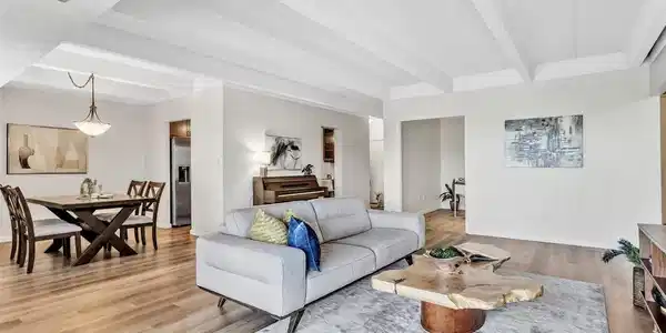 Image 3: Multiple seating areas create a warm, inviting space that lives larger than expected. Image 3: Multiple seating areas create a warm, inviting space that lives larger than expected.