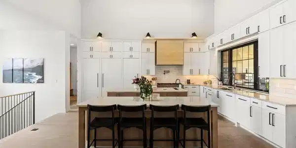 Image 4: The kitchen matches the scale: two large islands, quartzite counters, JennAir appliances, and a concealed walk-in pantry. Image 4: The kitchen matches the scale: two large islands, quartzite counters, JennAir appliances, and a concealed walk-in pantry.