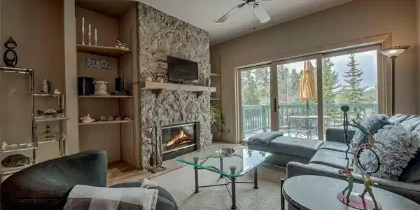 Image 4: A cozy fireplace and new patio doors