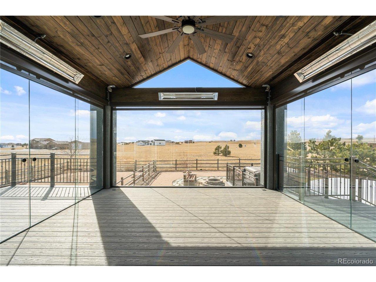 Image 4: Glass four seasons room (glass slides open), heaters, ceiling fan, and electronic shades.  This room is a show stopper!