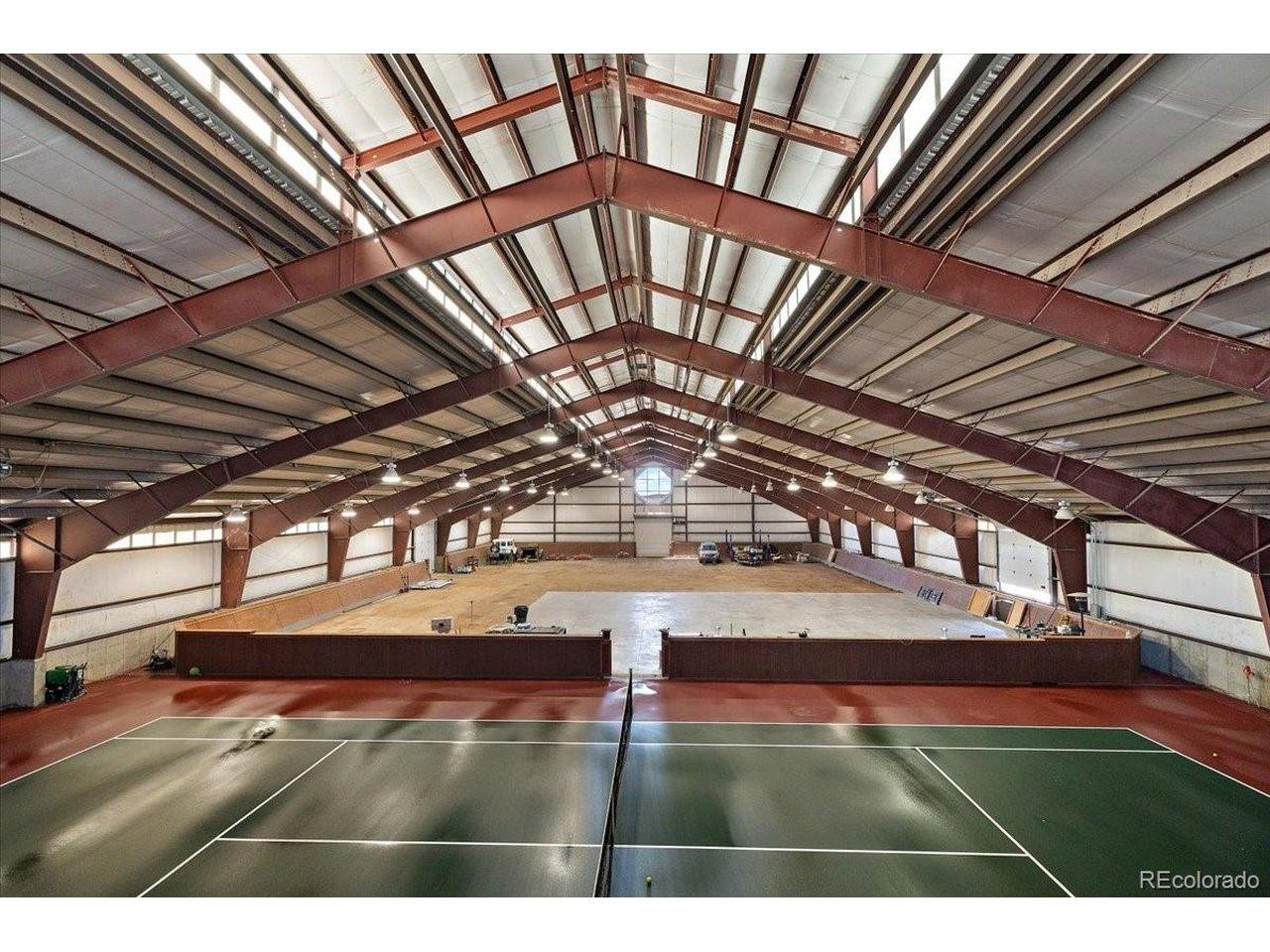 Image 2: Dirt area is approximately 9,050 Sq. ft., the Peak of the building is approximately 30 feet andsidewalls 14 ft. The concrete parking pad is 70 ft. x 56 ft., Tennis Court area is about 109 ft. x 60 ft., 2,525 sq. ft are living quarters