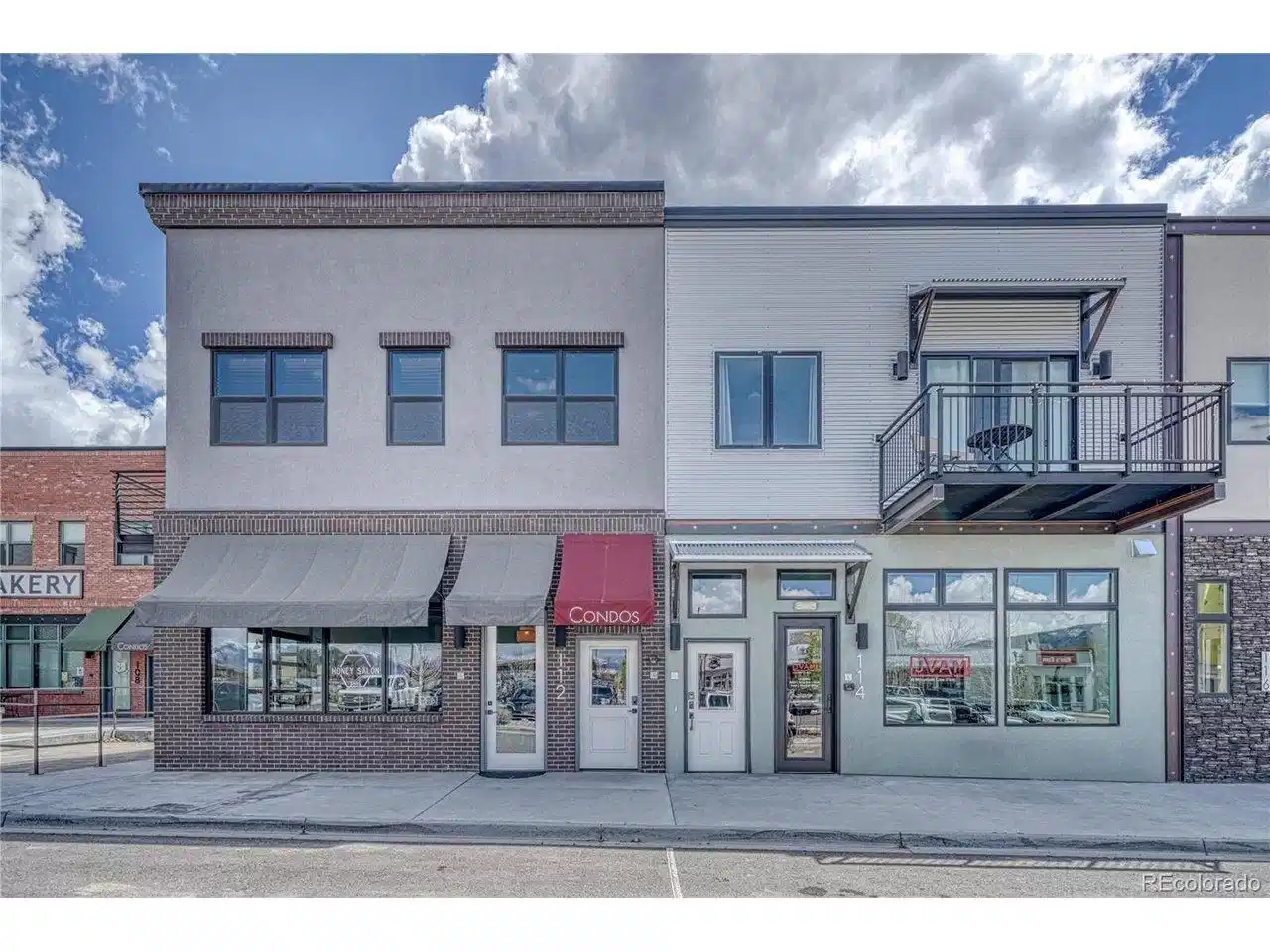 Image 1: 114 Old Stage Unit D is located on the east side of the building on the right.