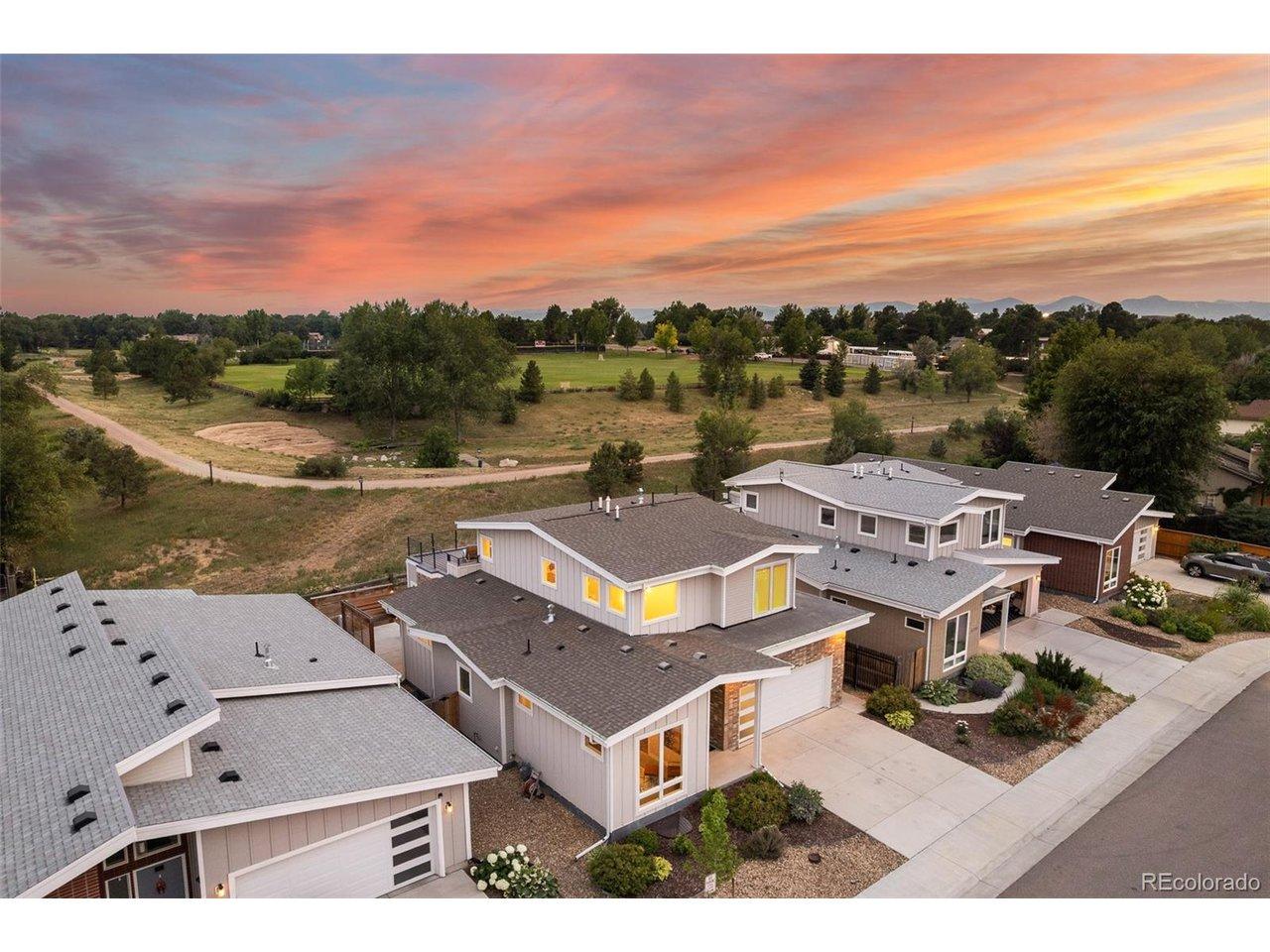 Image 2: Elevated aerial showcasing the home's unique setting backing to the Colorado Academy campus with no direct rear residential neighbors and views toward the Front Range. Image 2: Elevated aerial showcasing the home's unique setting backing to the Colorado Academy campus with no direct rear residential neighbors and views toward the Front Range.