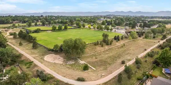 Image 4: Aerial view showcasing the Colorado Academy campus directly behind the home, creating a rare sense of privacy and openness. Image 4: Aerial view showcasing the Colorado Academy campus directly behind the home, creating a rare sense of privacy and openness.