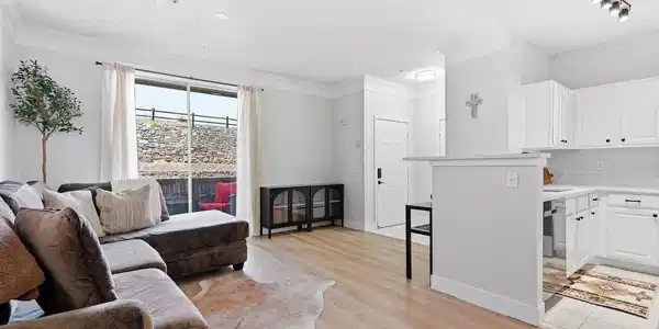 Image 3: LVP flooring, fresh paint, new baseboards and door casings are waiting inside this open floor plan that is filled with light from the sliding glass door.