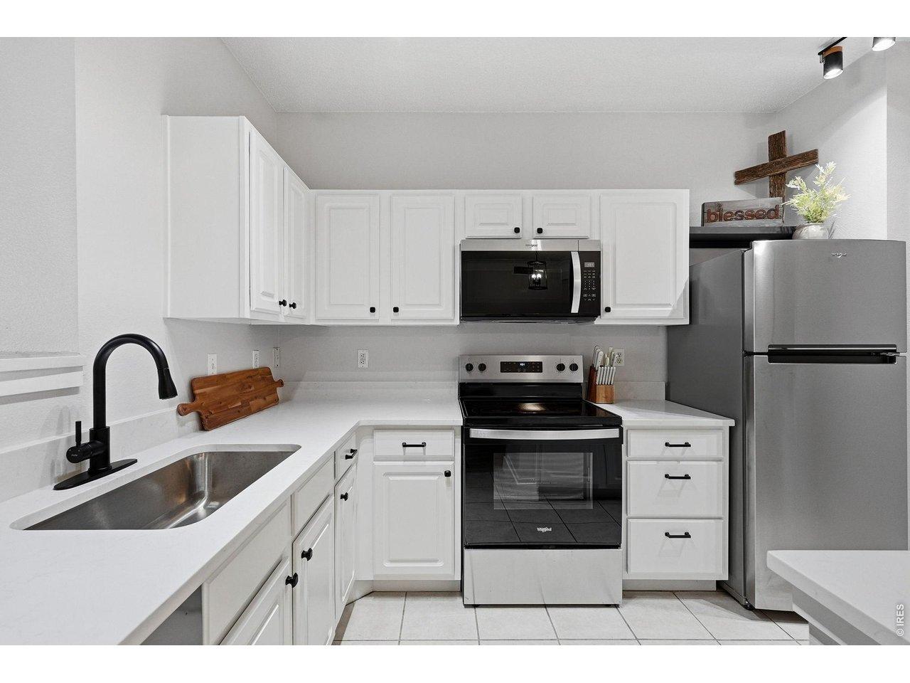 Image 4: New appliances and quartz counters were added in 2025 for a sizable and modern kitchen with a large pantry. Image 4: New appliances and quartz counters were added in 2025 for a sizable and modern kitchen with a large pantry.