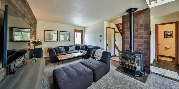 Image 3: Great room with gas fireplace, wood accent wall and vaulted ceiling Image 3: Great room with gas fireplace, wood accent wall and vaulted ceiling