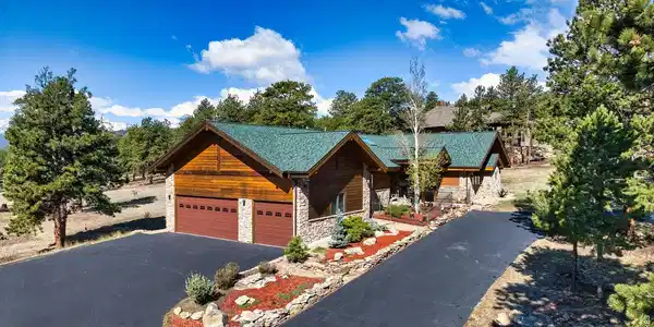 Image 4: Exceptional curb appeal with custom log and stone architecture, expansive driveway access, and refined mountain elegance. Image 4: Exceptional curb appeal with custom log and stone architecture, expansive driveway access, and refined mountain elegance.