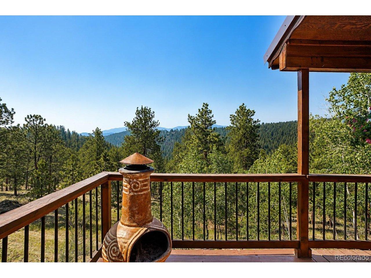 Image 2: wrap around deck overlooking open acreage