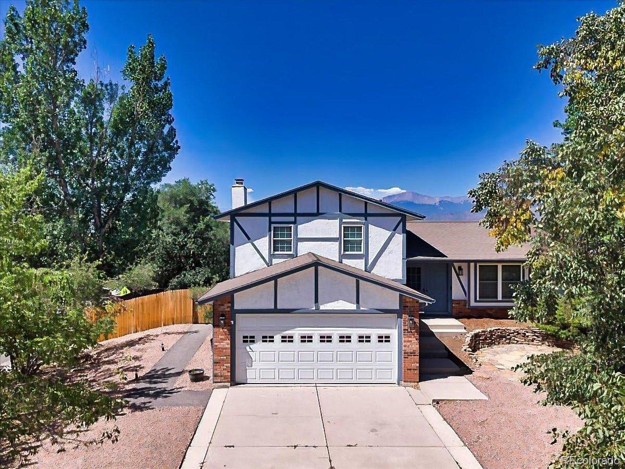 Image 1: Charming Tudor-inspired exterior with mature landscaping, an attached two-car garage, and attractive curb appeal on a spacious corner lot. Image 1: Charming Tudor-inspired exterior with mature landscaping, an attached two-car garage, and attractive curb appeal on a spacious corner lot.