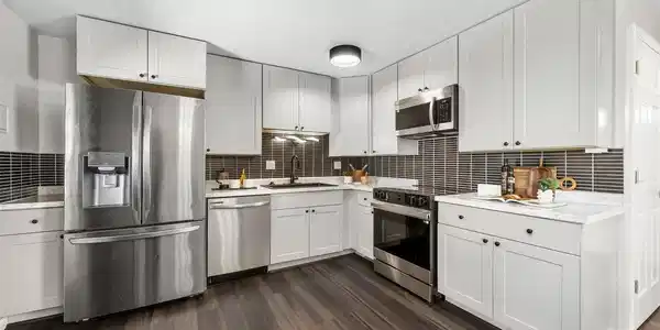 Image 2: Completely updated Kitchen with stainless appliances, updated cabinets, fantastic backsplash and backyard skyline views Image 2: Completely updated Kitchen with stainless appliances, updated cabinets, fantastic backsplash and backyard skyline views