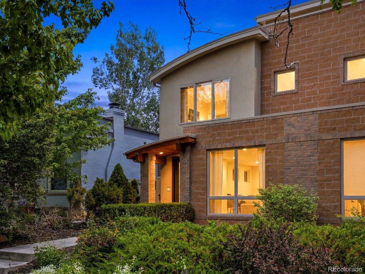 Image 2: Front entry with warm architectural lighting