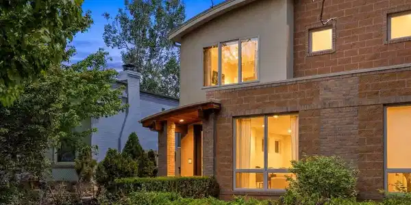 Image 2: Front entry with warm architectural lighting