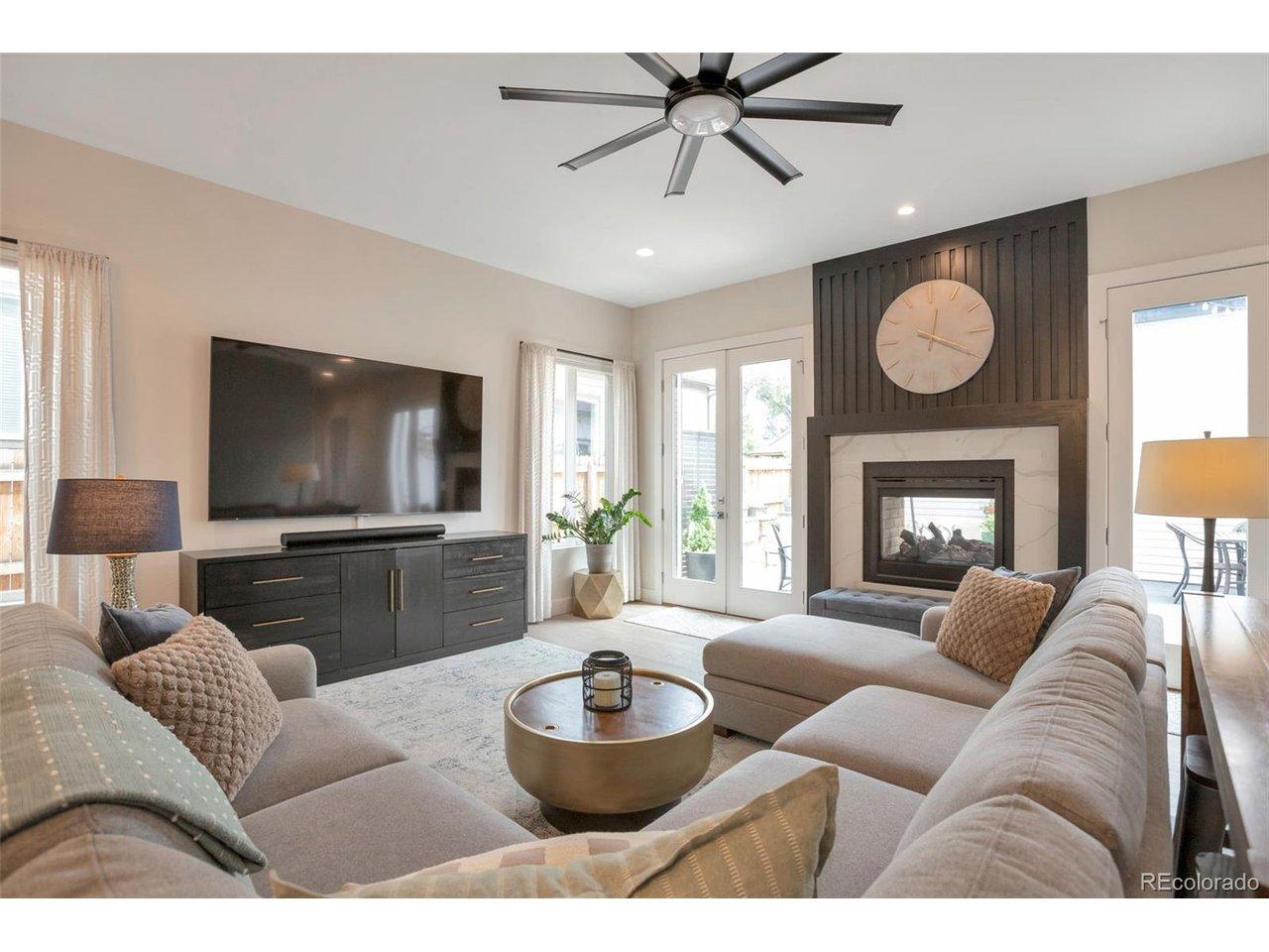 Image 4: Great room with lots of natural light from 2 sets of double doors, windows, see-thru fireplace Image 4: Great room with lots of natural light from 2 sets of double doors, windows, see-thru fireplace