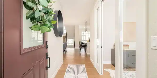 Image 3: Front door opens to immediate brightness from the multiple west and south facing windows. Image 3: Front door opens to immediate brightness from the multiple west and south facing windows.