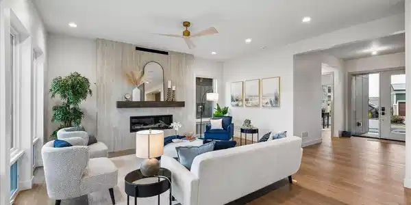 Image 3: Refined living room with floor-to-ceiling fireplace surround. Image 3: Refined living room with floor-to-ceiling fireplace surround.