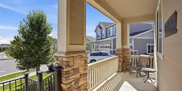 Image 2: Upon arrival, you are greeted by an elegant covered patio entrance-the perfect spot for your morning coffee or unwinding in the evening.
