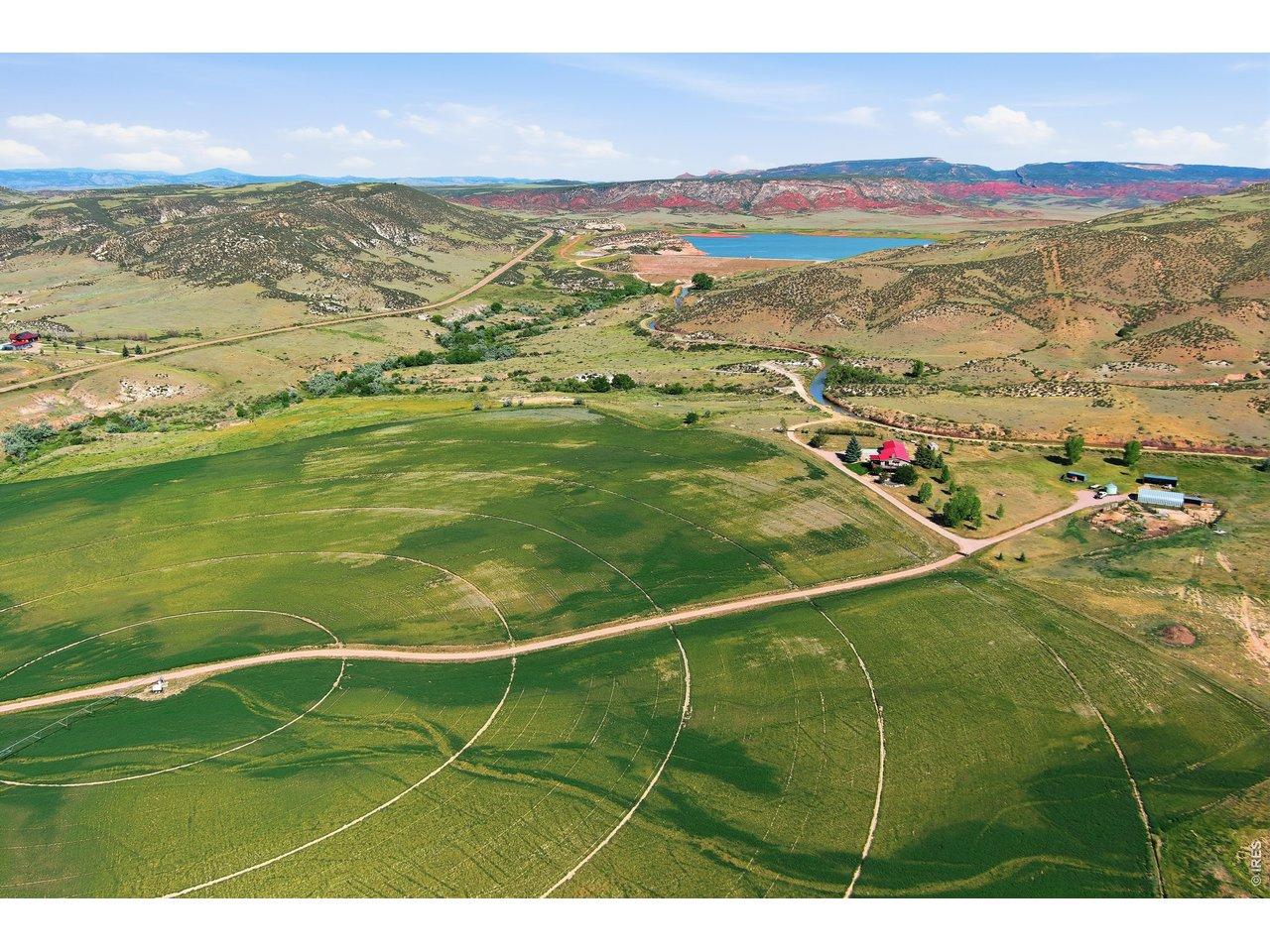 Image 1: Location, location, location! This home and 214 acres are located at the first head gate after the Park Creek Reservoir. 1 water share, natural spring dating back to the 1800's with year round water at 55 degrees and 5 gun center pivot in alfalfa. Image 1: Location, location, location! This home and 214 acres are located at the first head gate after the Park Creek Reservoir. 1 water share, natural spring dating back to the 1800's with year round water at 55 degrees and 5 gun center pivot in alfalfa.