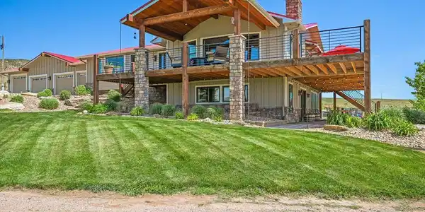 Image 3: Enjoy the covered deck on a hot summer day or the uncovered deck to take in the sunshine. Image 3: Enjoy the covered deck on a hot summer day or the uncovered deck to take in the sunshine.