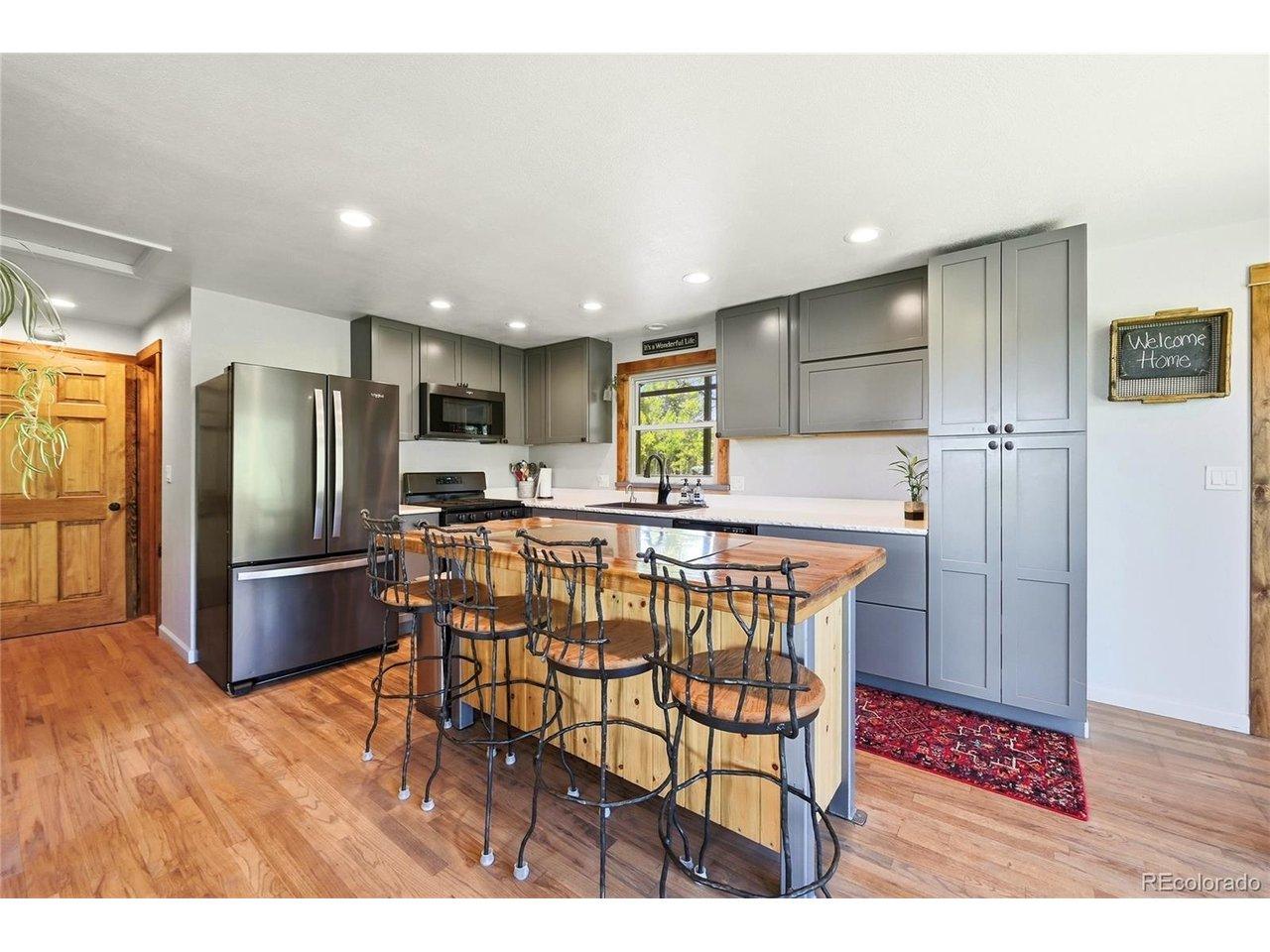 Image 4: Remodeled kitchen with custom island and pantry closet Image 4: Remodeled kitchen with custom island and pantry closet