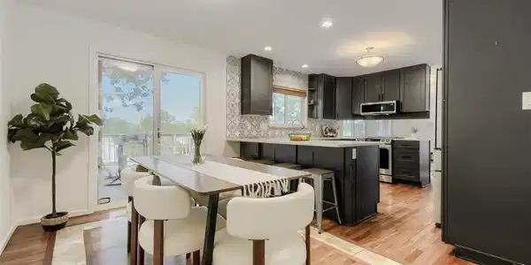 Image 3: Kitchen dining area opening to large patio deck with awesome views