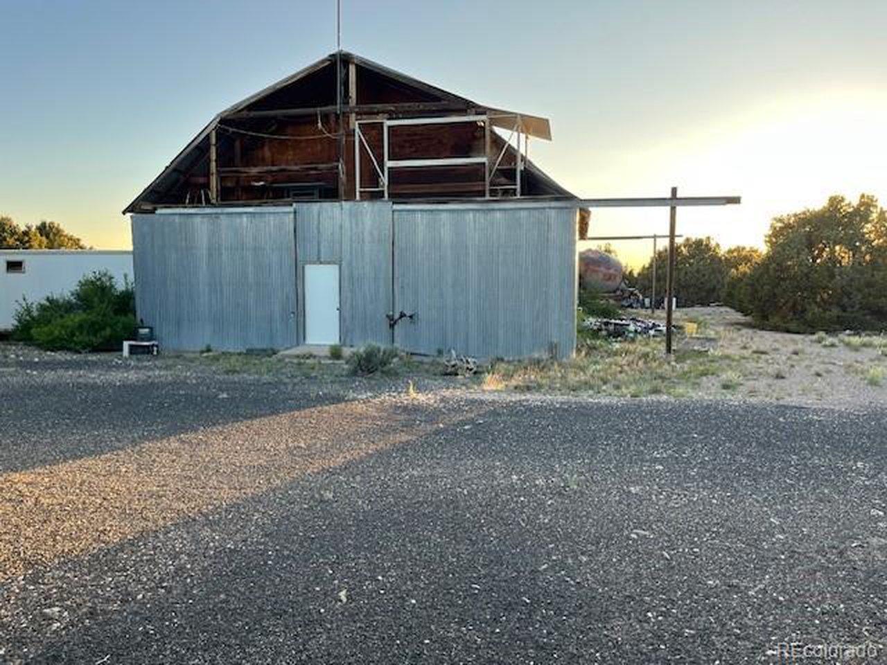 Image 1: Front of barn with porch above. Image 1: Front of barn with porch above.