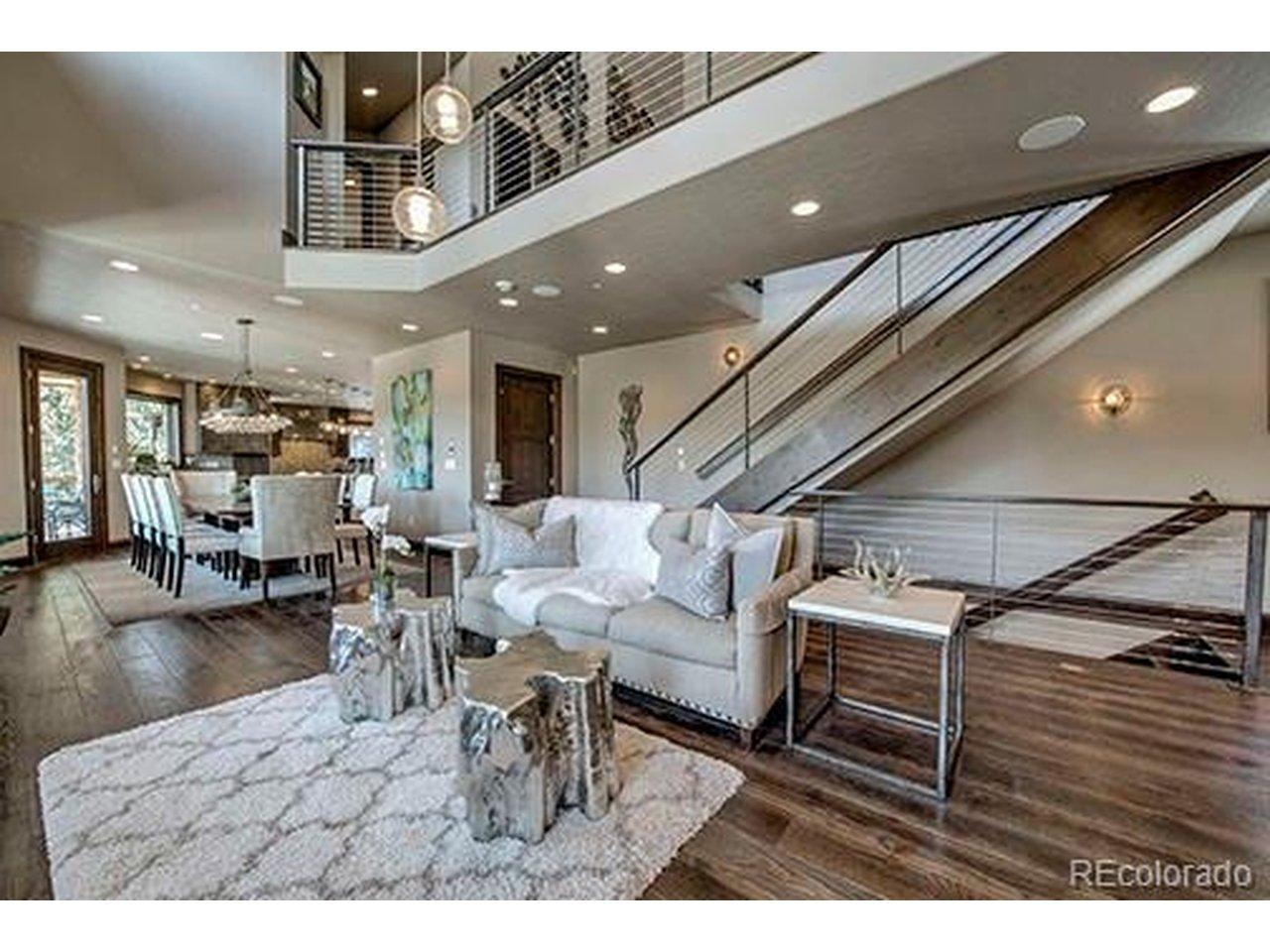 Image 3: Open-concept design seamlessly connecting living,dining, and kitchen spaces with exceptional flow.