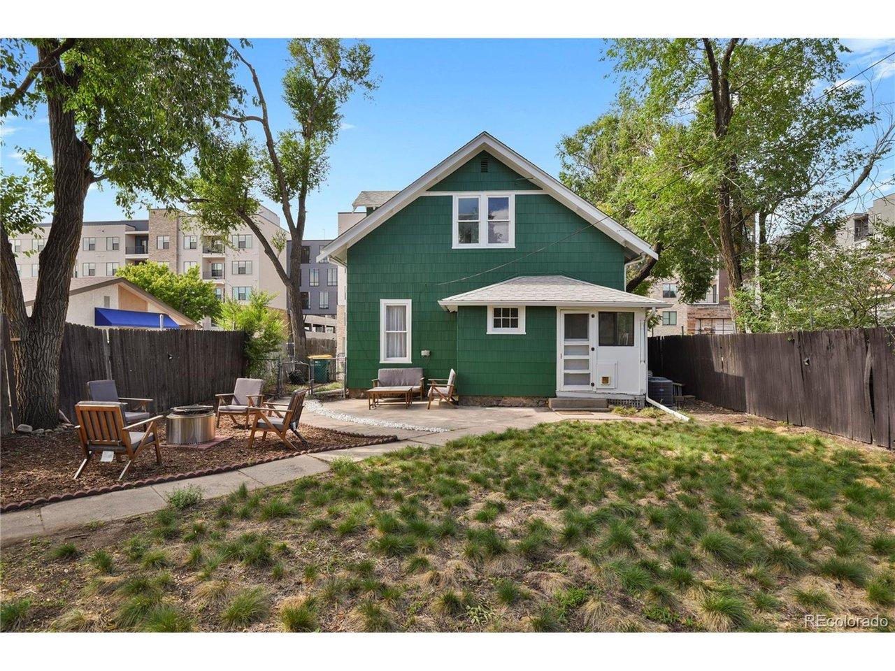 Image 2: Spacious backyard with drought-resistant grass Image 2: Spacious backyard with drought-resistant grass