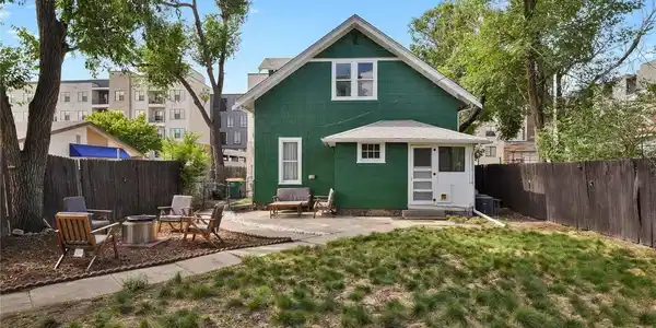 Image 2: Spacious backyard with drought-resistant grass Image 2: Spacious backyard with drought-resistant grass